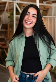 Front view smiley arab woman posing indoors